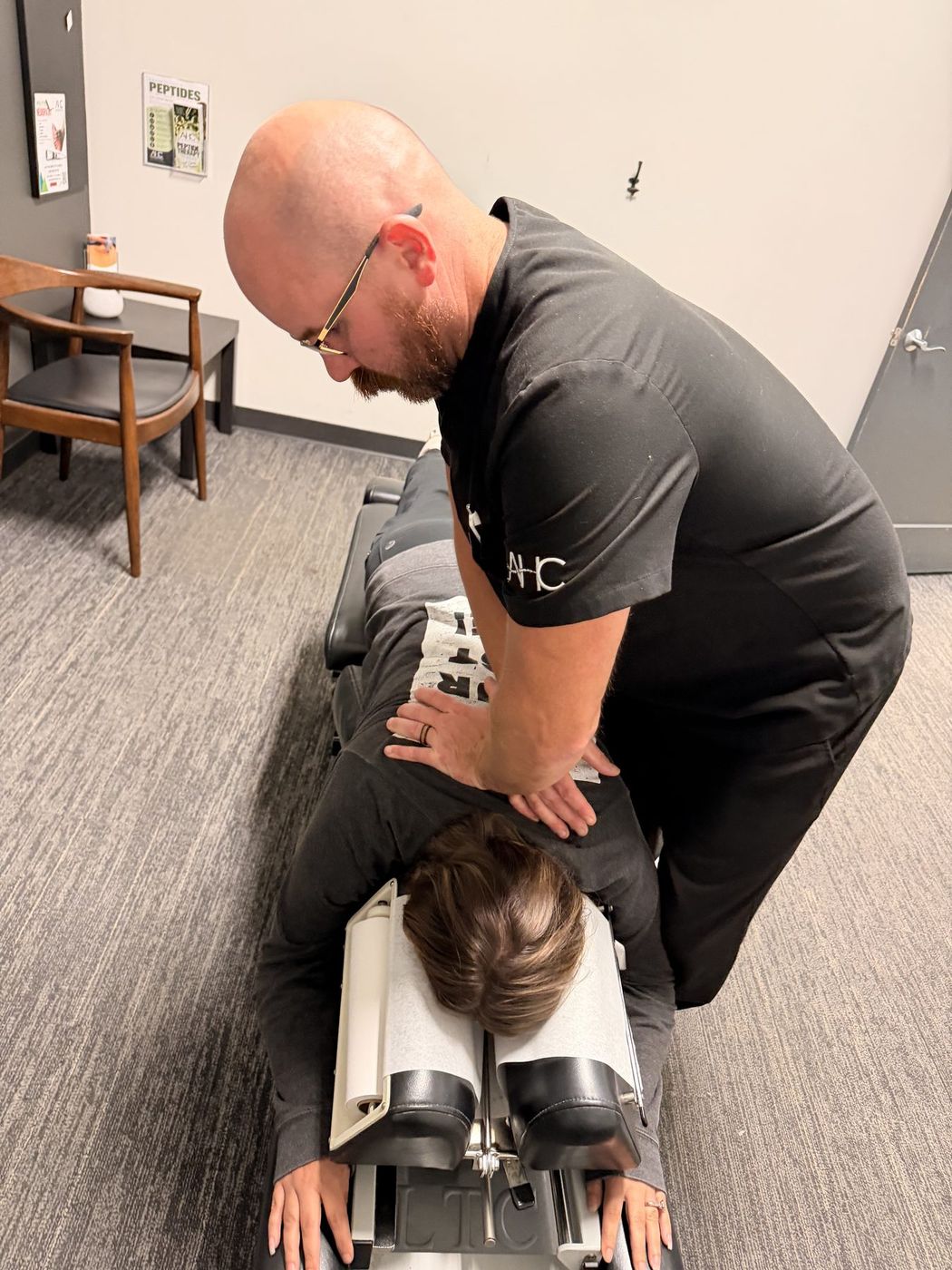 Dr. Zach Mason giving a chiropractic adjustment at Active Health Clinics