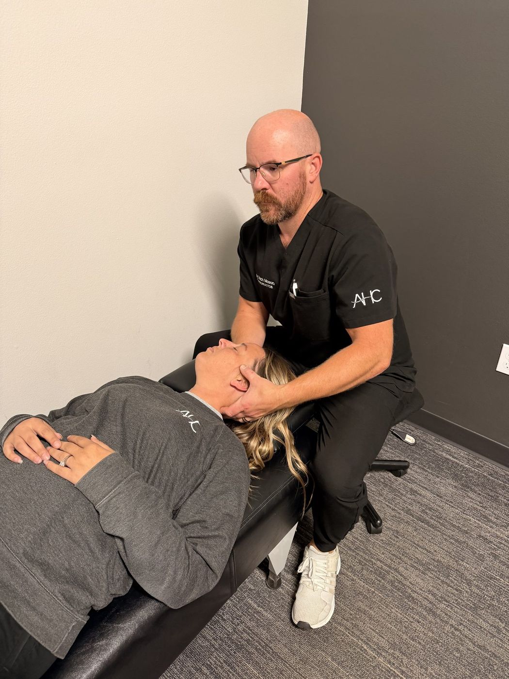 Dr. Zach Mason giving a chiropractic adjustment at Active Health Clinics