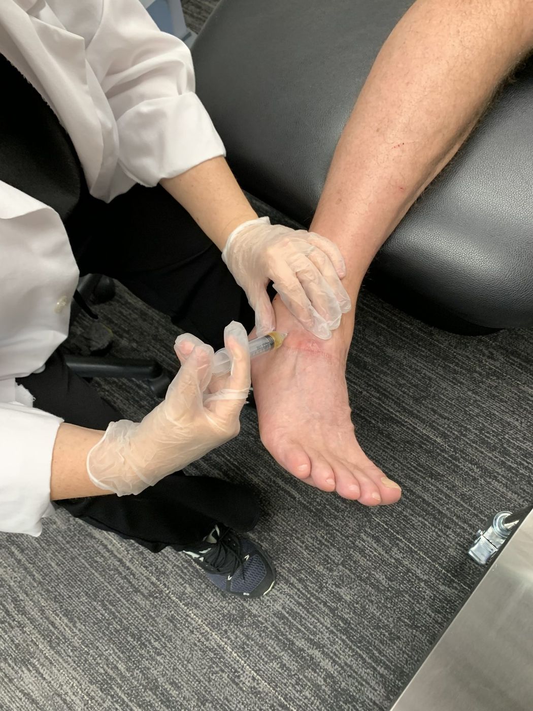 A provider giving a joint injection at Active Health Clinics