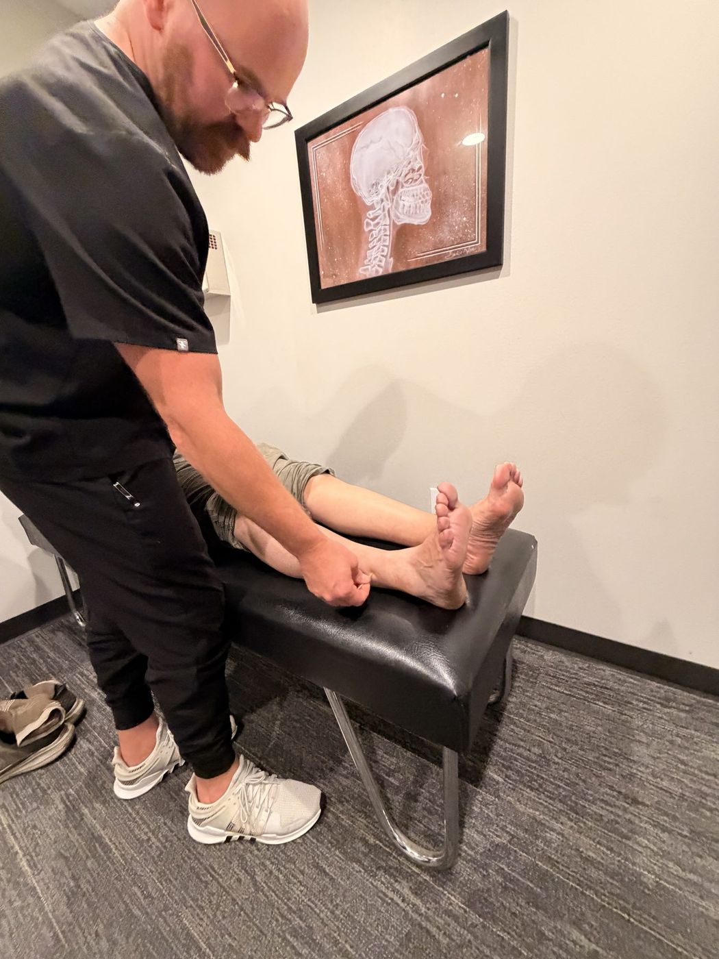 Neuropathy sensory testing on a patient's feet at Active Health Clinics