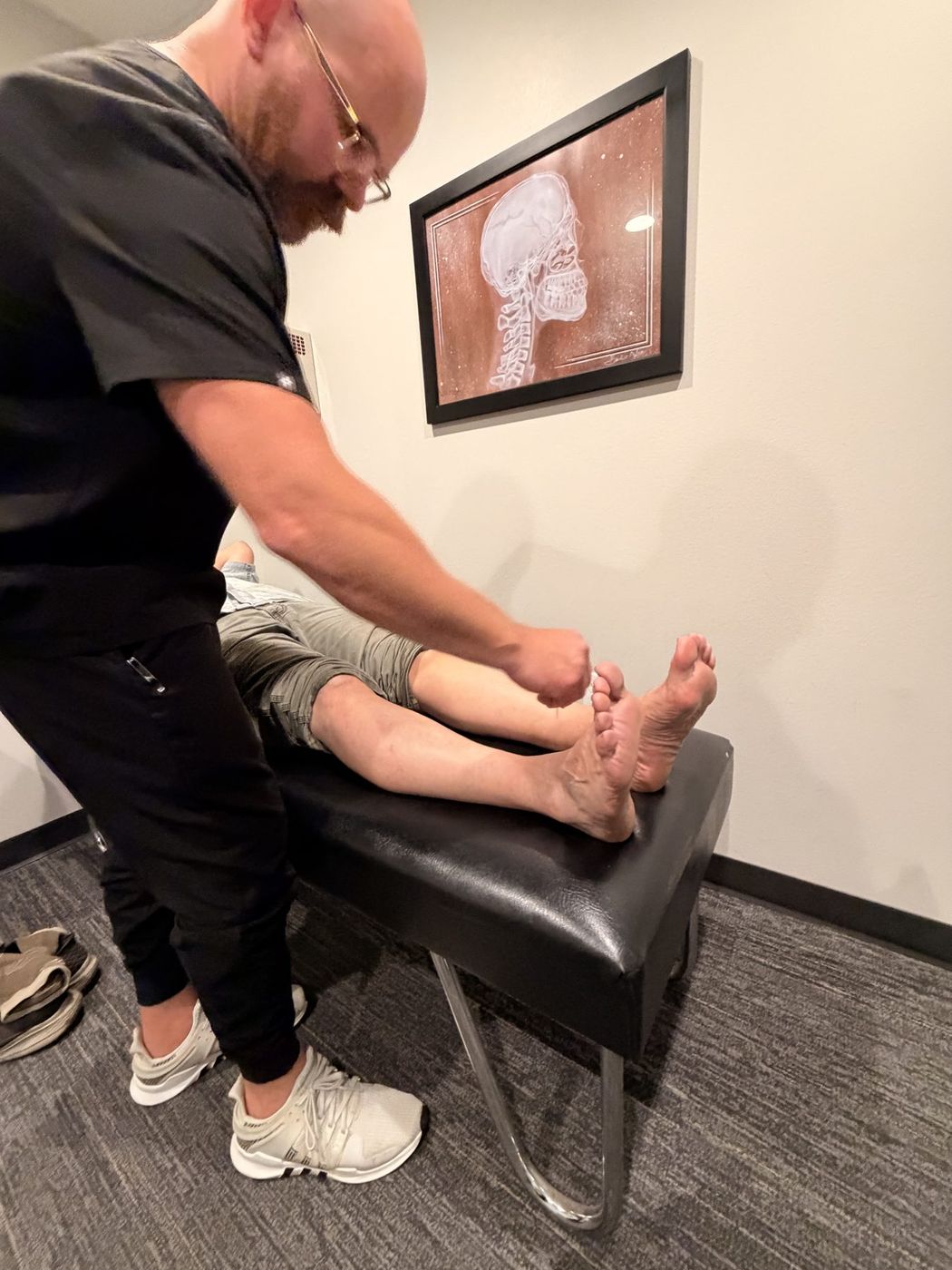 Dr. Zach Mason performing a neuropathy pin-prick sensory exam at Active Health Clinics